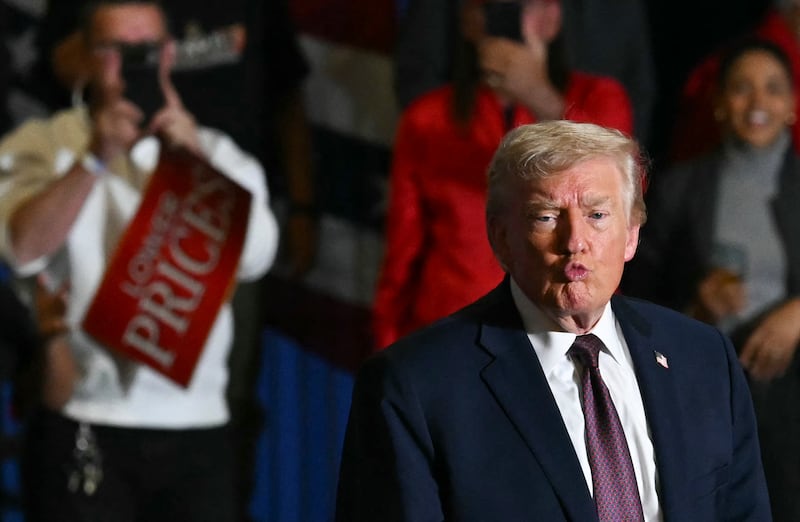 US President Donald Trump gestures to the crowd after speaking at a political rally in Rocky Mount, North Carolina on December 19, 2025. (Photo by ANDREW CABALLERO-REYNOLDS / AFP via Getty Images)