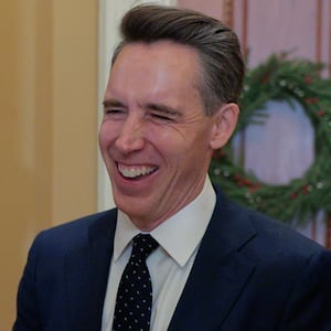 Sen. Josh Hawley (R-MO) talks with friends before attending the weekly Senate Republican policy luncheon the U.S. Capitol on December 09, 2025 in Washington, DC.