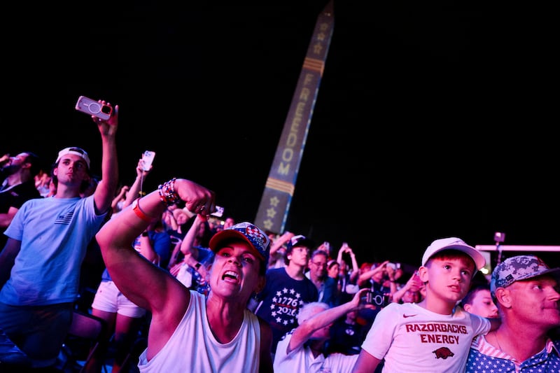People watch a fireworks display that is attempting the largest firework display in history with 850,000 fireworks, at a Fourth of July rally featuring U.S. President Donald Trump, marking the 250th anniversary of U.S. independence, on the National Mall in Washington, D.C., U.S., July 5, 2026. REUTERS/Evan Vucci     TPX IMAGES OF THE DAY