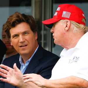Donald Trump, Tucker Carlson and Marjorie Taylor Greene during the 3rd round of the LIV Golf Invitational Series Bedminster on July 31, 2022 at Trump National Golf Club in Bedminster, New Jersey.