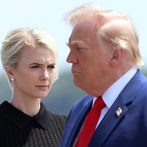 DOVER, DELAWARE - JULY 22: Natalie Harp, executive assistant to U.S. President Donald Trump, stands as President Trump arrives for a dignified transfer at Dover Air Force Base for military casualties of the war with Iran on July 22, 2026 in Dover, Delaware. Trump attend the dignified transfer of of Army 1st Lt. Tyler James Feehan, Staff Sgt. Michael Emmanuel Swinton, Army Sgt. Angel S. Rampersad and Army Pvt. Isabella Gonzales. (Photo by Kevin Dietsch/Getty Images)