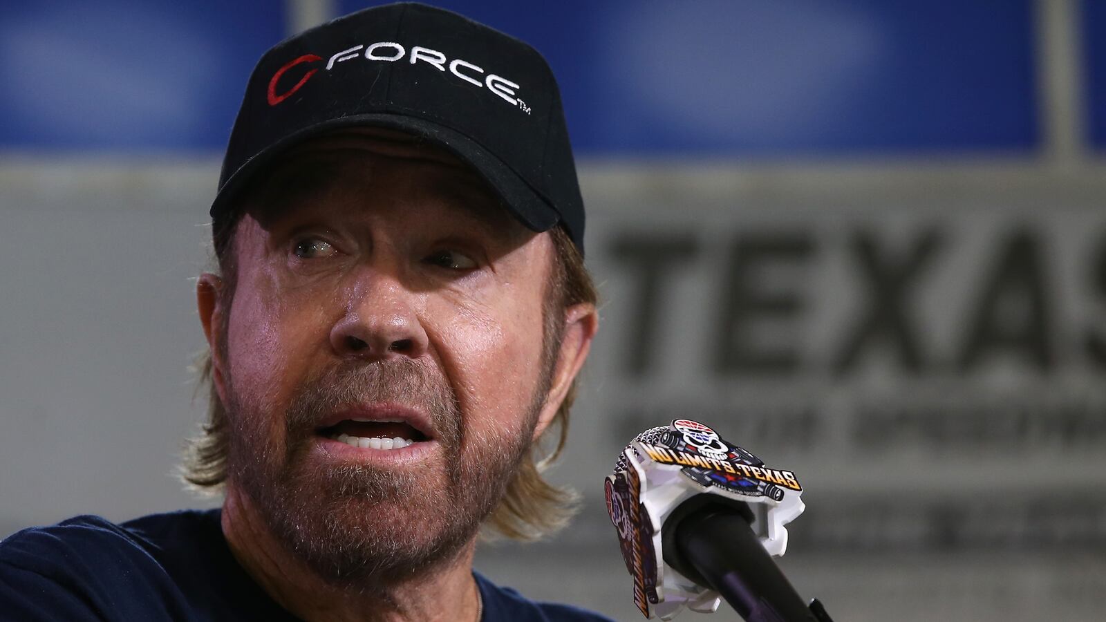 Actor Chuck Norris speaks with the media prior to the NASCAR Sprint Cup Series AAA Texas 500 at Texas Motor Speedway on November 6, 2016