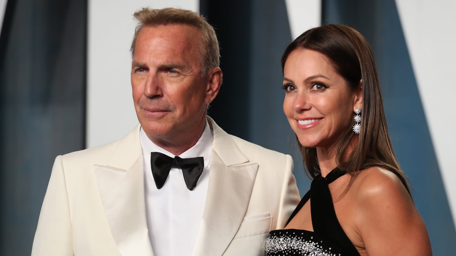 A picture of Kevin Costner and Christine Baumgartner, who are getting a divorce and in an ongoing feud over child support payments. A court recently ordered Costner to hand over neaarly $130,000 in child support a month to his estranged wife.