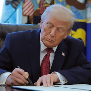 WASHINGTON, DC - DECEMBER 15: U.S. President Donald Trump signs an executive order classifying fentanyl as a "weapon of mass destruction," during a ceremony for the presentation of the Mexican Border Defense Medal in the Oval Office of the White House on December 15, 2025 in Washington, DC. During the ceremony, Trump recognized the first 13 service members to receive the recently established Mexican Border Defense Medal (MBDM), which recognizes service members supporting Customs and Border Protection on the U.S.-Mexico border. (Photo by Anna Moneymaker/Getty Images)