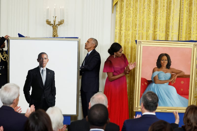 Former U.S. President Barack Obama and former first lady Michelle Obama attend the unveiling of their official White House portraits, painted by Robert McCurdy and Sharon Sprung, respectively, in the East Room of the White House, in Washington, U.S., September, 7, 2022. REUTERS/Evelyn Hockstein