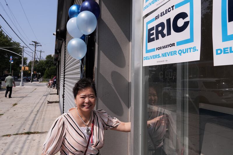 Winnie Greco walks inside after hanging balloons for the ribbon-cutting ceremony at Eric Adams' Brooklyn campaign office on August 7, 2025.