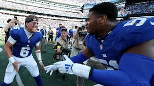 Jaxson Dart #6 of the New York Giants and Abdul Carter #51 of the New York Giants celebrate following a win against the Los Angeles Chargers