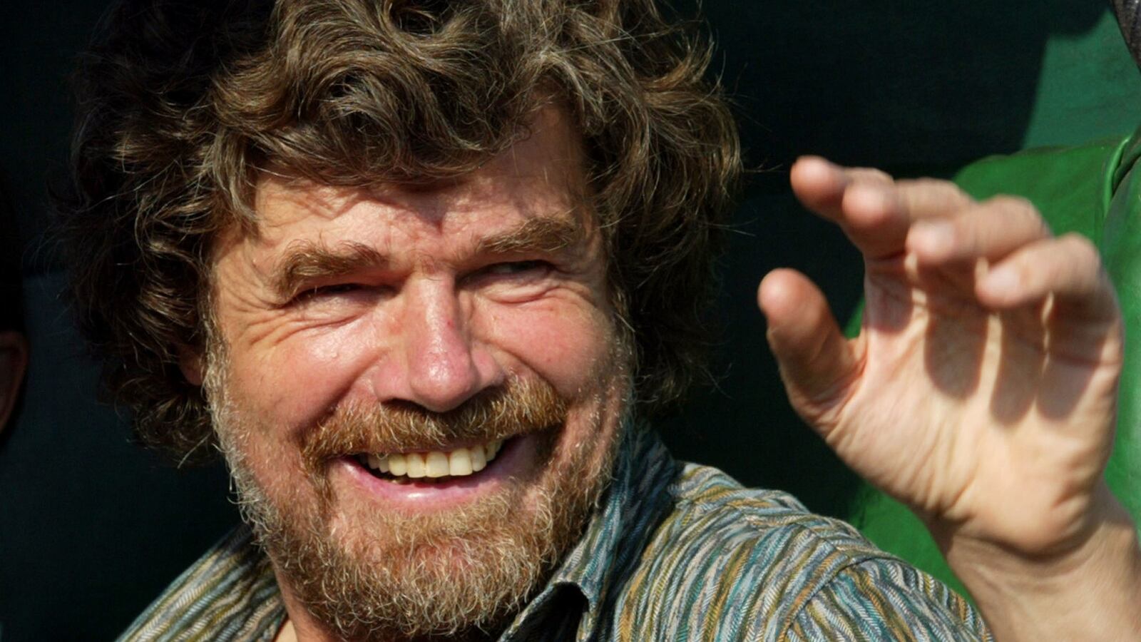 Italian-born mountaineer Reinhold Messner waves to the crowd in Kathmandu during the golden jubilee celebrations of the first ascent of the 8201 metre peak Mount Cho-Oyu