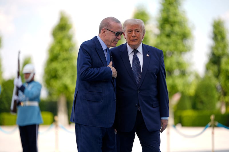 U.S. President Donald Trump speaks with Turkish President Recep Tayyip Erdogan during a formal arrival at the Bestepe Presidential Compound at the NATO summit in Ankara, Turkey, Tuesday, July 7, 2026.