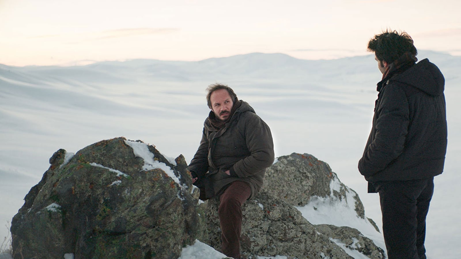 A photo including a still from the film About Dry Grasses