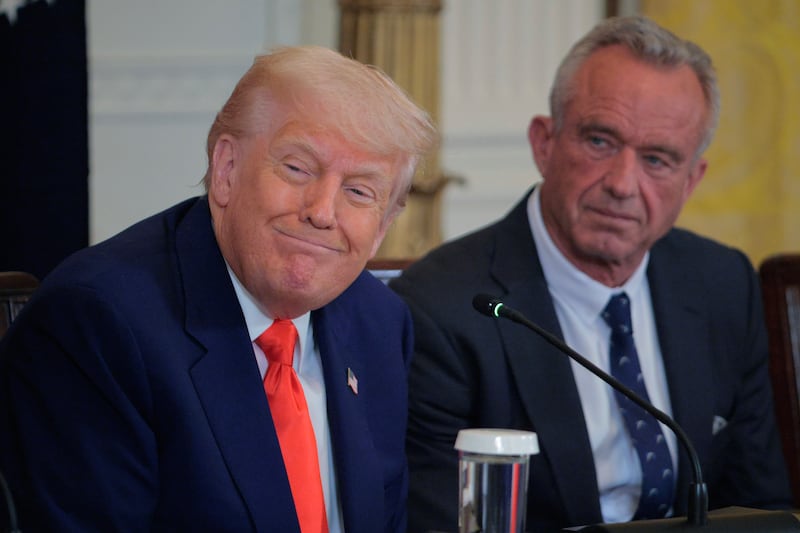President Donald Trump and Robert F. Kennedy Jr. attend an event introducing a new Make America Healthy Again Commission report in the East Room of the White House on May 22, 2025 in Washington, DC