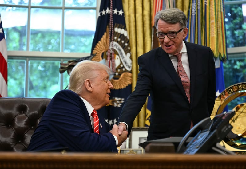 US President Donald Trump shakes hands with British ambassador to the United States Peter Mandelson after making a trade announcement in the Oval Office of the White House in Washington, DC, on May 8, 2025. US President Donald Trump on Thursday announced a "full and comprehensive" trade agreement with Britain, which would be the first such deal since he launched his global tariffs blitz. (Photo by Jim WATSON / AFP) (Photo by JIM WATSON/AFP via Getty Images)