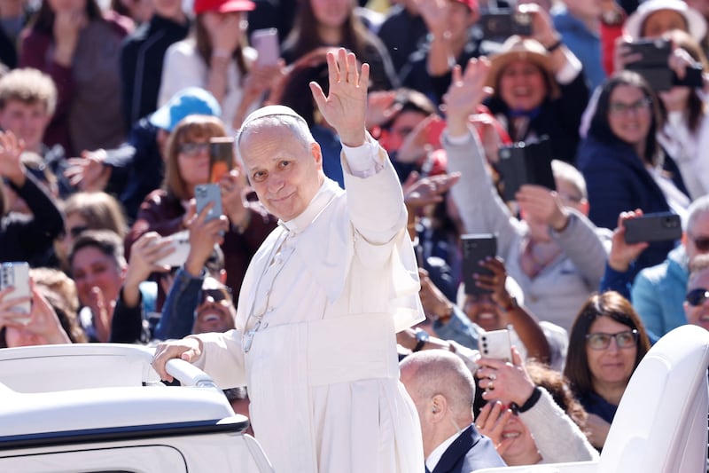 Pope Leo XIV waves on the day he holds the weekly general audience in Saint Peter's Square at the Vatican, April 8, 2026.