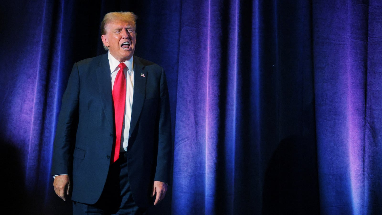 Donald Trump reacts to the crowd, including hecklers, as he leaves the stage after addressing the Libertarian Party’s national convention in Washington on May 25.