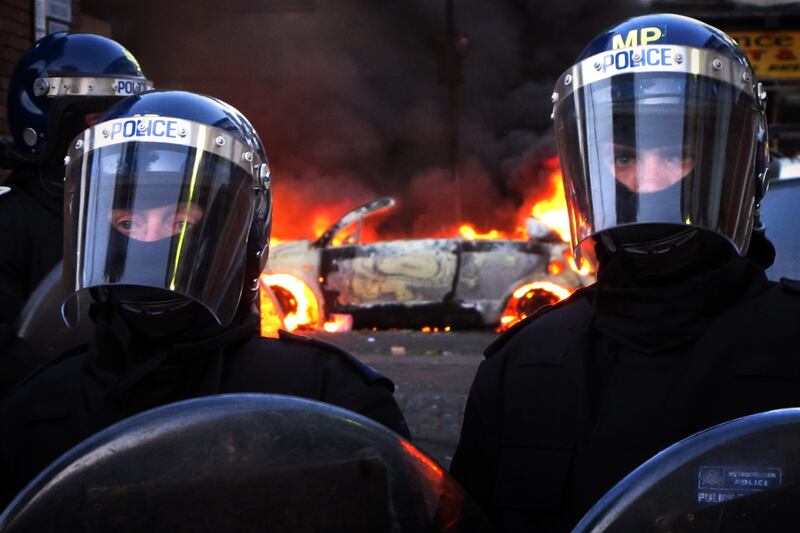 articles/2011/08/08/london-riots-spread-photos-videos-and-tweets/london-riots-police-mcnamara_m2gbhu