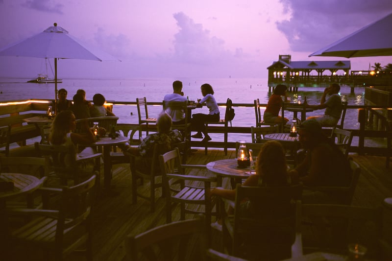 articles/2014/07/13/a-magical-meal-at-louie-s-backyard-in-the-conch-republic/140701-mjstern-roadfood-louies-tease_ke2c8t