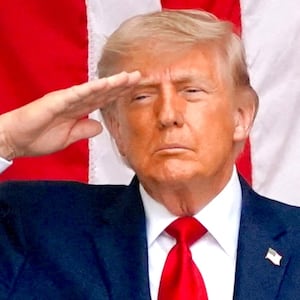 U.S. President Donald Trump and U.S. Vice President JD Vance salute in the Memorial Amphitheater during a Memorial Day event at Arlington National Cemetery, Arlington, Virginia, U.S., May 25, 2026.