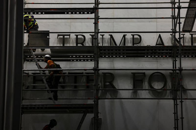 Workers prepare scaffolding ahead of removing lettering from the facade of the John F. Kennedy Memorial Center for the Performing Arts,