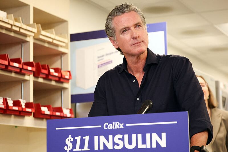 California Governor Gavin Newsom listens to a question during a press conference announcing $11 insulin and prescription drugs with the CalRX program inside a Cedars-Sinai pharmacy in Los Angeles, California on October 16, 2025.