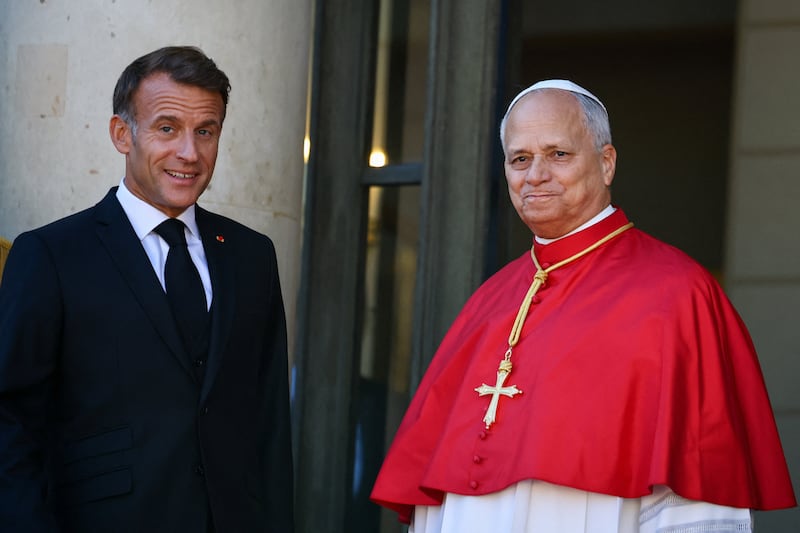 French President Emmanuel Macron welcomes Pope Leo as he arrives for a meeting with authorities, members of civil society and the diplomatic corps at the Elysee Palace in Paris as part of his four-day apostolic journey to France, September 25, 2026.