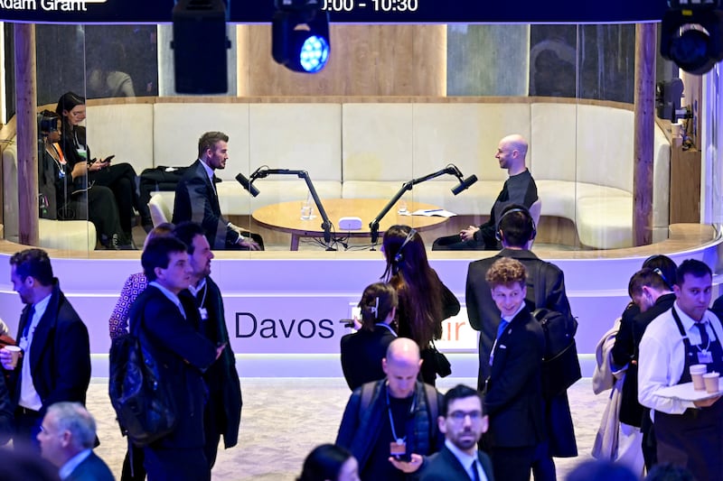 British former football player David Beckham (C-L) records a podcast during the World Economic Forum (WEF) annual meeting in Davos on January 20, 2026. The World Economic Forum takes place in Davos from January 19 to January 23, 2026. (Photo by Fabrice COFFRINI / AFP via Getty Images)