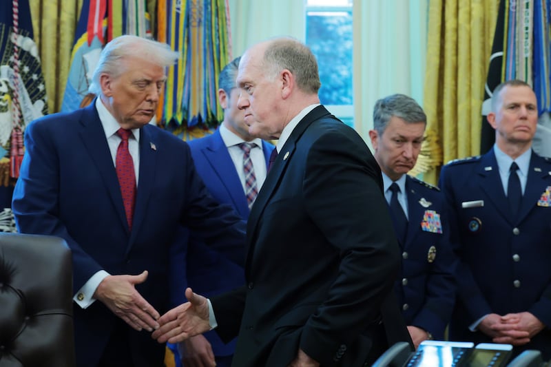 U.S. President Donald Trump shakes hands with White House Border Czar Tom Homan