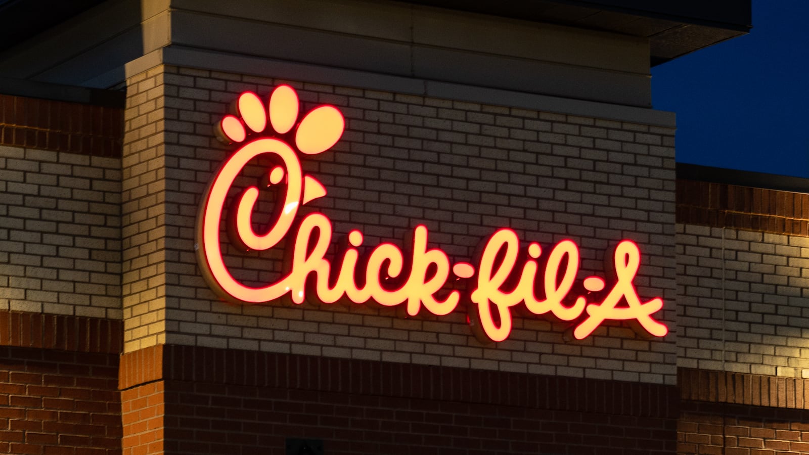 A Chick-fil-A fast food restaurant location on an early summer evening in West St. Paul, Minnesota.