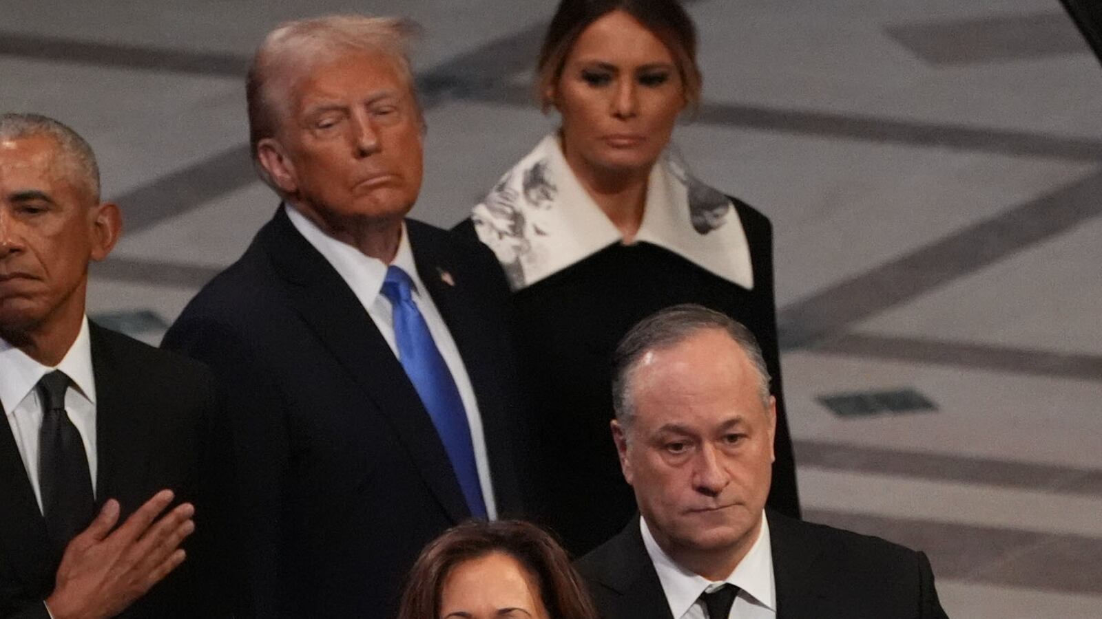 WASHINGTON, DC - JANUARY 9: Former President Bill Clinton, former Secretary of State Hillary Clinton, former President George W. Bush, former First Lady Laura Bush, former President Barack Obama, President-elect Donald Trump and his wife Melania Trump, President Joe Biden, First Lady Jill Biden, Vice President Kamala Harris and Second Gentleman Doug Emhoff watch as the casket of former President Jimmy Carter is carried away during state funeral services at the National Cathedral at the National Cathedral on January 9, 2025 in Washington, D.C. (Photo by Demetrius Freeman/The Washington Post via Getty Images)