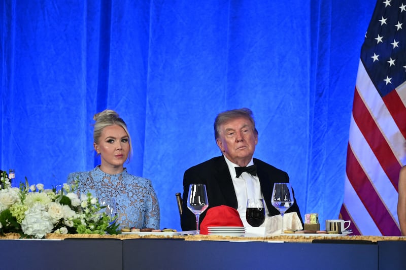 White House Press Secretary Karoline Leavitt and US President Donald Trump watch Oz 'Oz the Mentalist' Pearlman perform during the 2026 White House Correspondents' Association (WHCA) Dinner at the Waldorf Astoria in Washington, DC, on July 24, 2026. The 2026 WHCA Dinner was originally scheduled for April 25 at the Washington Hilton, but was rescheduled and relocated after an alleged gunman breached security. (Photo by Mandel NGAN / AFP via Getty Images)