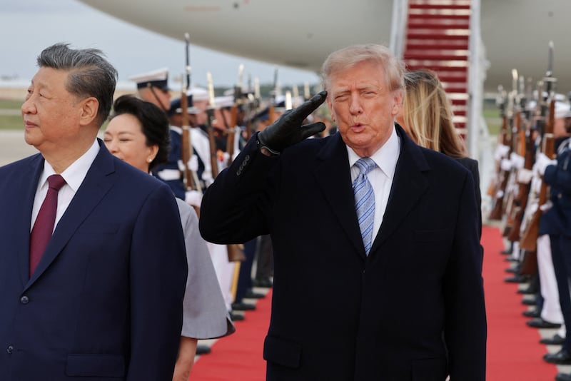 President Donald Trump salutes next to Chinese President Xi Jinping as he arrives ahead of a state visit at Joint Base Andrews, Maryland, September 23, 2026.