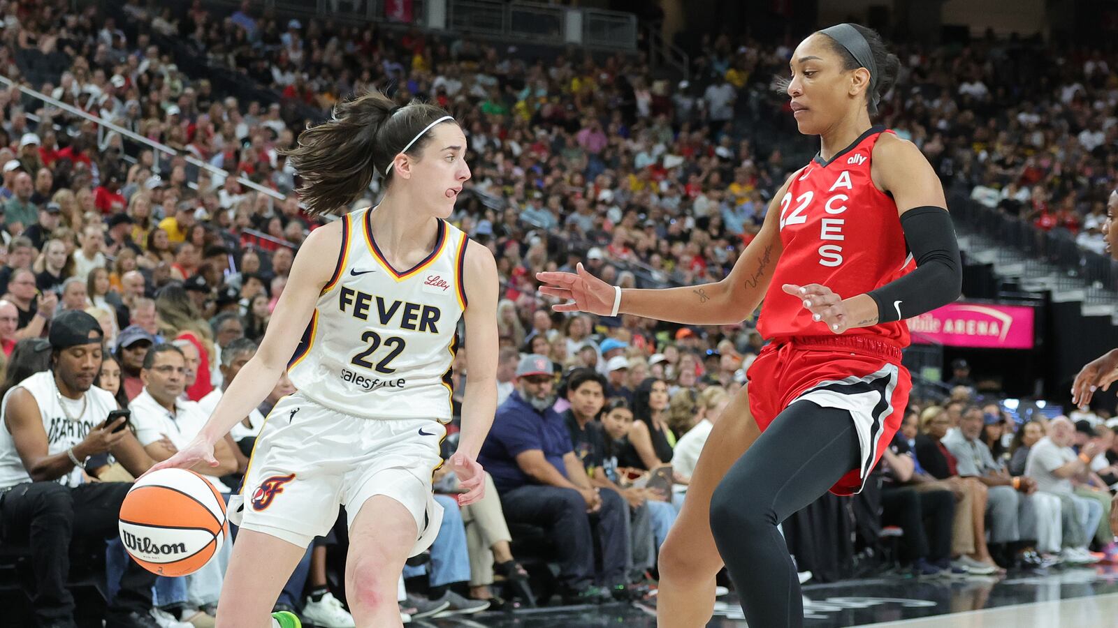 Caitlin Clark #22 of the Indiana Fever is guarded by A'ja Wilson #22 of the Las Vegas Aces in the first quarter of their game