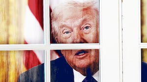 Donald Trump looking out a window.