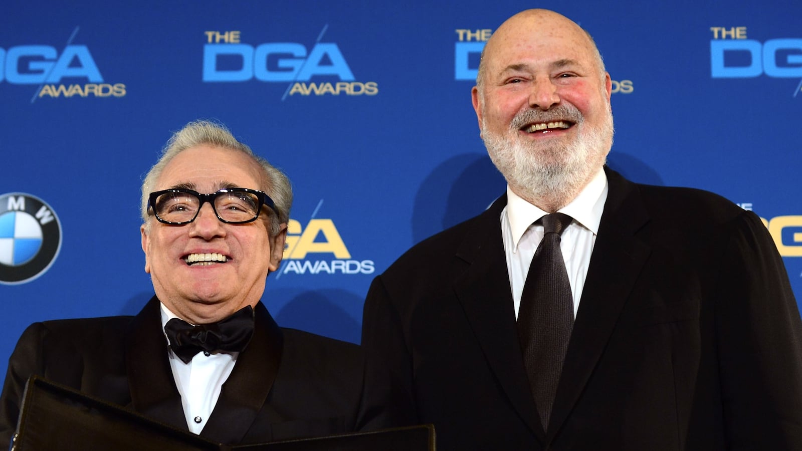 Rob Reiner flanks Martin Scorsese posing with his trophy For Outstanding Directorial Achievement in Feature Film "The Wolf Of Wall Street" in the press room at the 66th Annual Directors Guild of America Awards January 25, 2014 at the Hyatt Regency Century Plaza in Century City, California. AFP PHOTO FREDERIC J. BROWN (Photo credit should read FREDERIC J. BROWN/AFP via Getty Images)