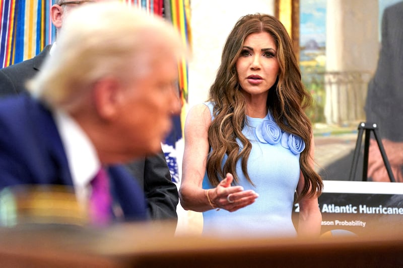 Kristi Noem speaks about the Federal Emergency Management Agency next to Donald Trump, in the Oval Office at the White House, in Washington, D.C., U.S., June 10, 2025.