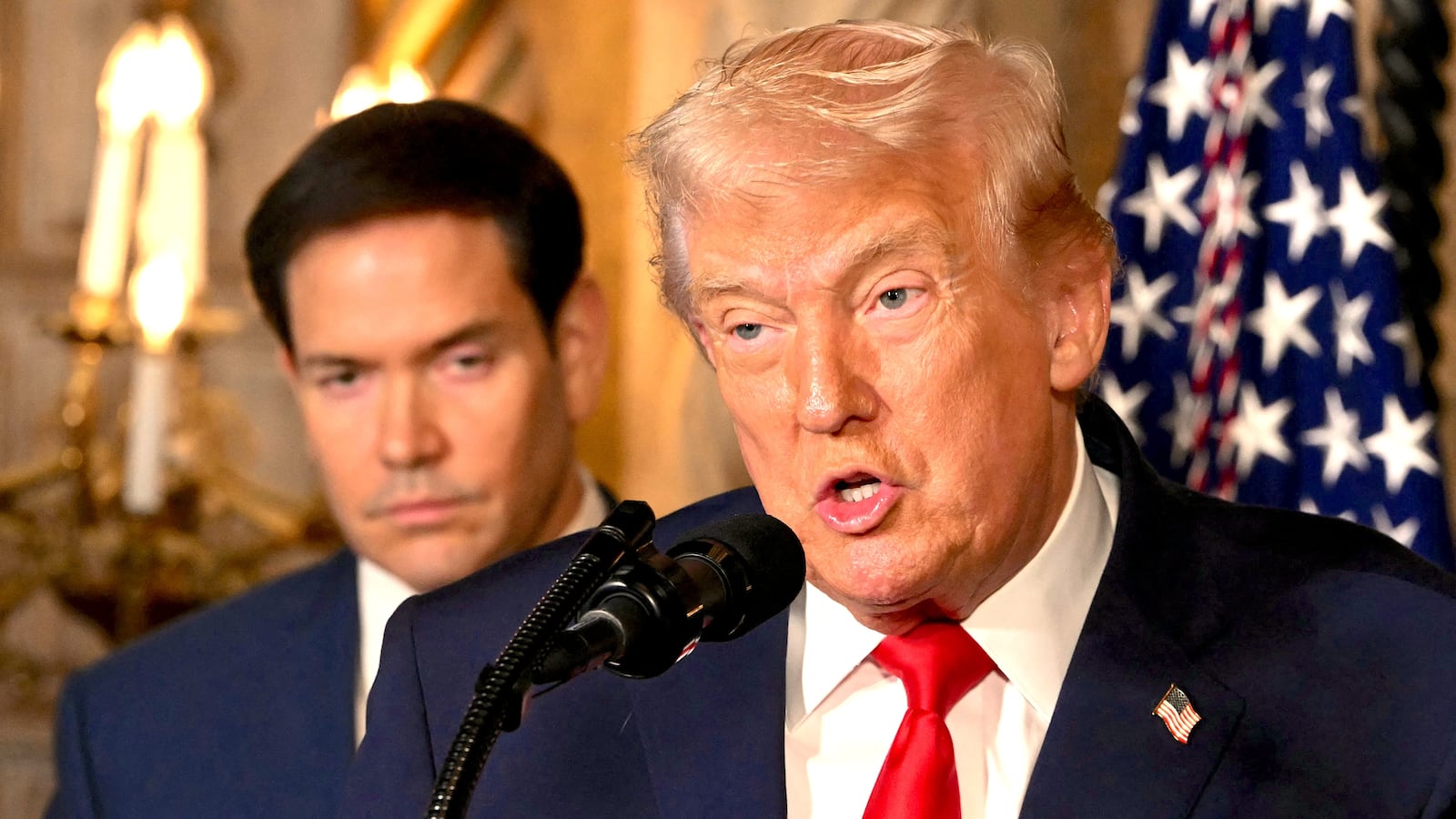 US Secretary of State Marco Rubio looks on as US President Donald Trump speaks
