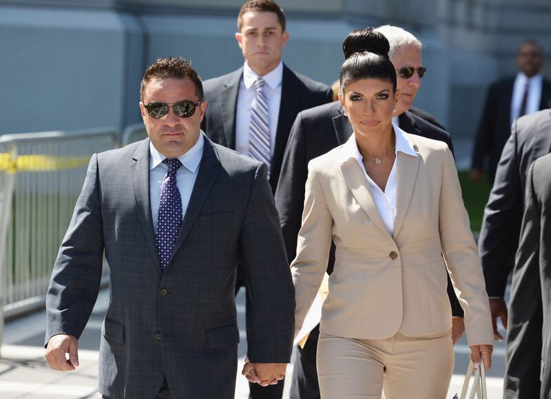 Giuseppe "Joe" Giudice (L) and wife Teresa Giudice leave court in 2013.