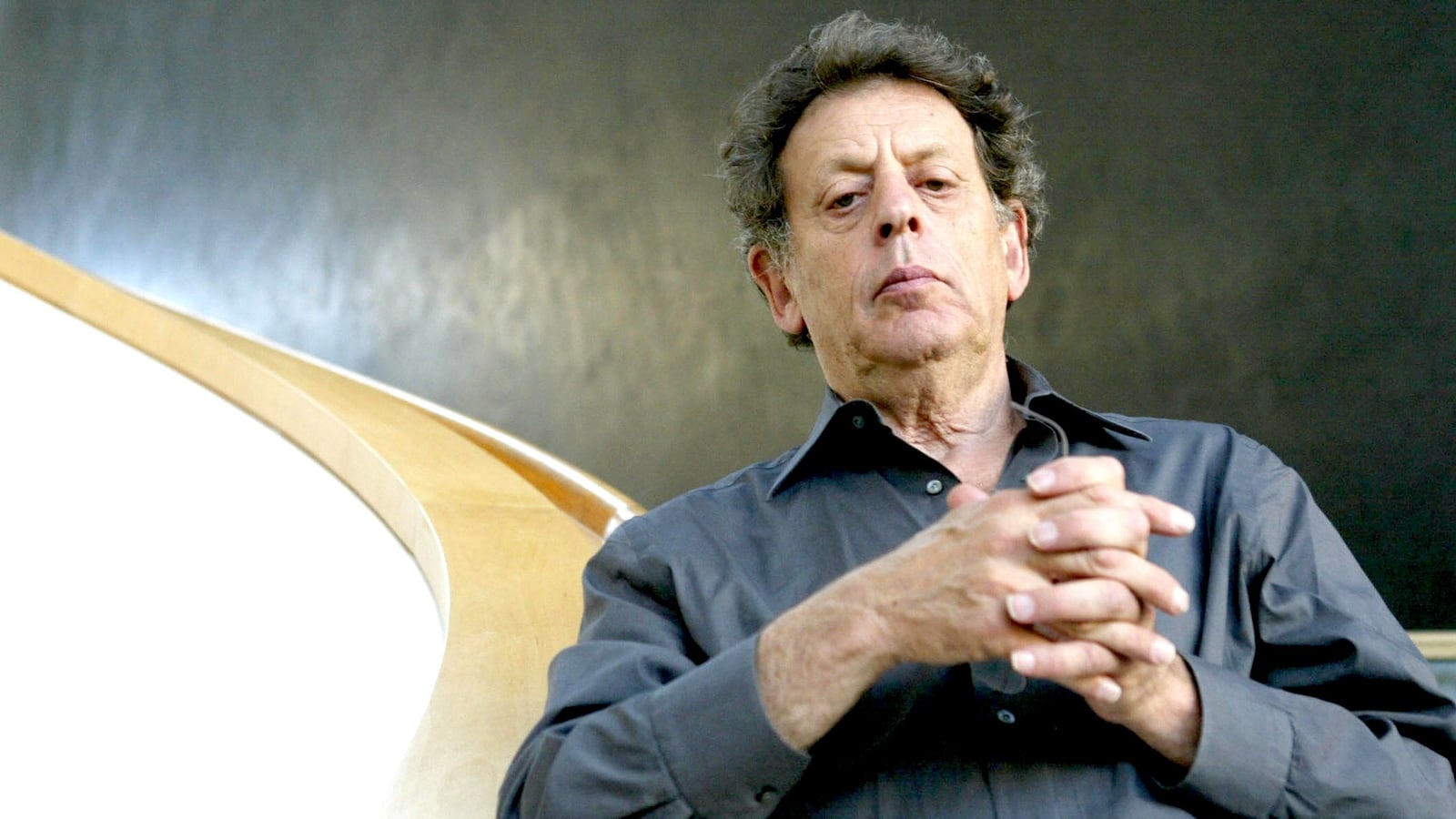 US minimalist composer Philip Glass poses on 05 September 2005 at the theatre of Erfurt, eastern Germany. He composed for the theatre the opera titled "Waiting for the Barbarians" that will have its world premiere on 10 September 2005 in the eastern German town.