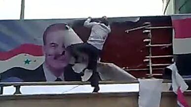 cheats/2011/03/26/syrian-protesters-attack-buildings/syria-conflict-protestor_mfdwpx