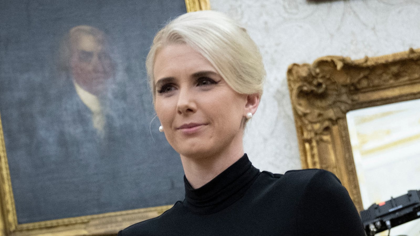 Executive Assistant to the President Natalie Harp, 34, stands in the Oval Office on March 31.