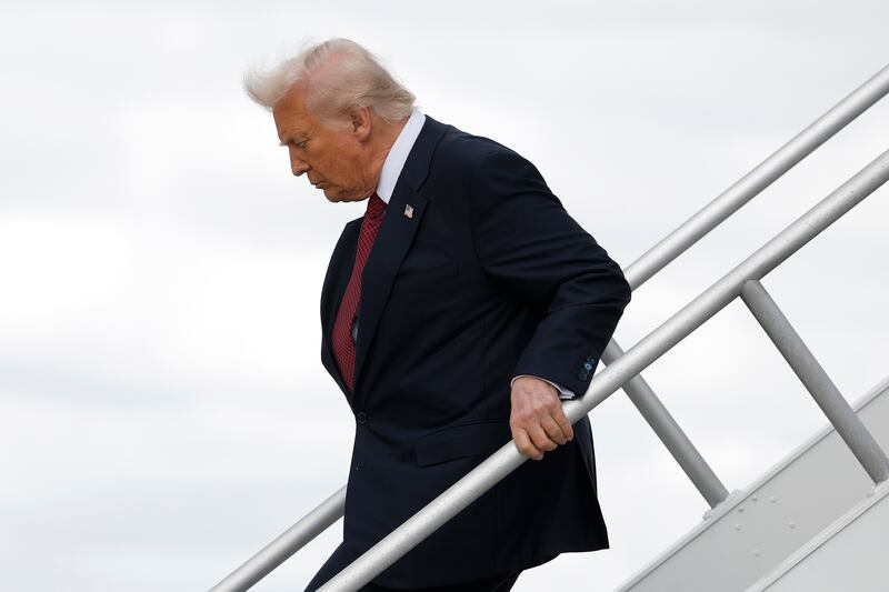 President Donald Trump arrives at Miami International Airport to attend the America Business Forum on November 05, 2025 in Miami, Florida.