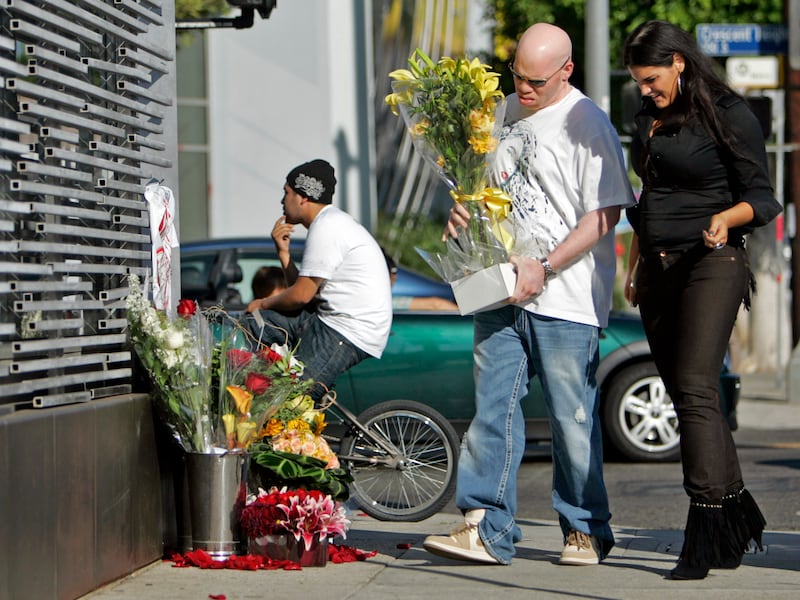 Music fans bring flowers to a memorial set up for plane crash victims Travis Barker, former drummer for the group Blink182 and Adam Goldstein, known as celebrity DJ AM, along with four others who were killed in South Carolina Saturday night.