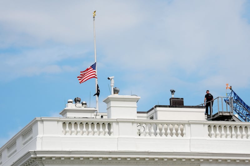 A U.S. flag flies at half-staff atop the White House in Washington, D.C., U.S., July 12, 2026. Senator Lindsey Graham, who represented South Carolina for more than two decades, died early this morning at 71.