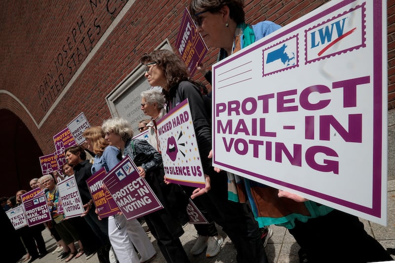 Supporters gather outside the federal courthouse after a hearing in a lawsuit brought by a coalition of Democratic state attorneys general seeking to block U.S. President Donald Trump's executive order tightening rules on mail-in voting, in Boston, Massachusetts, U.S., June 2, 2026.