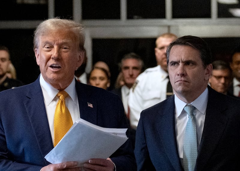 Former US President Donald Trump, with lawyer Todd Blanche (R), speaks to the press as he arrives to attend his trial for allegedly covering up hush money payments linked to extramarital affairs, at Manhattan Criminal Court in New York City, on May 14, 2024.