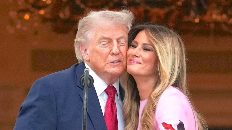U.S. President Donald Trump and first lady Melania Trump stand close to each other during the Congressional Picnic at the White House in Washington, D.C., U.S., May 19, 2026.