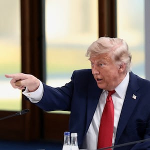 U.S. President Donald Trump, French President Emmanuel Macron and British Prime Minister Keir Starmer attend a working session with G7 leaders and outreach partners on promoting economic growth during the G7 Summit in Evian-les-Bains, France, June 17, 2026. REUTERS/Evelyn Hockstein