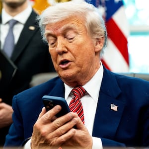 President Donald Trump, pictured silencing his cellphone in the Oval Office on May 23, has long been known for picking up the phone and making calls to reporters to get his side of a story out.
