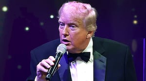 President Donald Trump speaks to guests during a New Year’s Eve event at his Mar-a-Lago home on December 31, 2025 in Palm Beach, Florida.