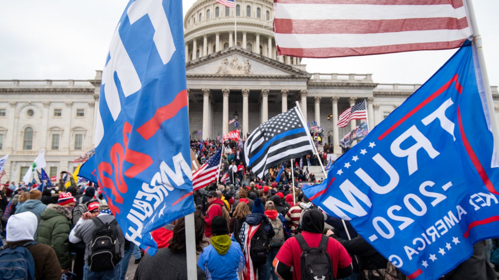 Trump flags fly as rioters take over the steps of the Capitol on the East Front.