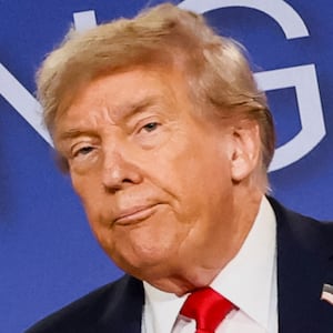 U.S. President Donald Trump looks on during a press conference with Russian President Vladimir Putin following their meeting to negotiate an end to the war in Ukraine, at Joint Base Elmendorf-Richardson, in Anchorage, Alaska, U.S., August 15, 2025. REUTERS/Kevin Lamarque